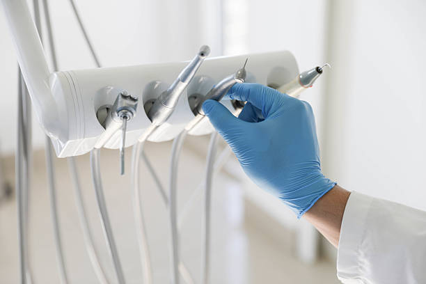 Professional Emergency Dentist technician working in Iowa City, IA